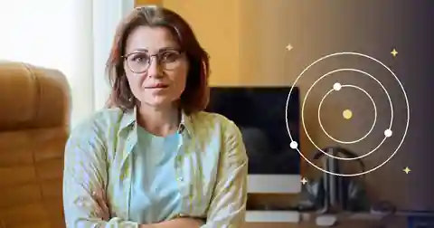 US 2028 Election Astrology: Themes, Limits and Symbols Woman in an office setting with subtle orbital symbolism representing political astrology