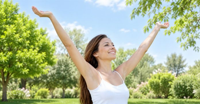 Dream reflection — restored outdoor portrait Woman in a white top standing in a leafy garden with her arms raised